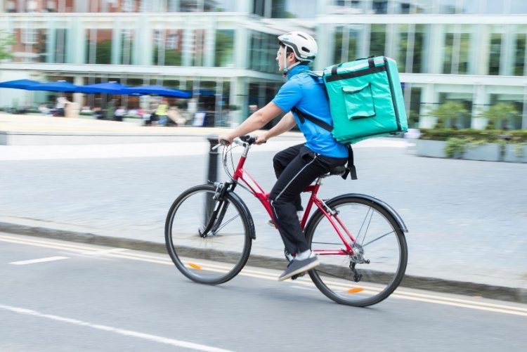 restaurant delivery man riding a bike
