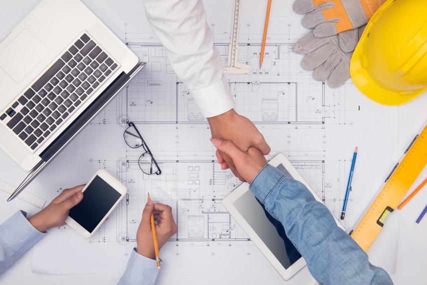 home remodeling contractor shaking hands with client