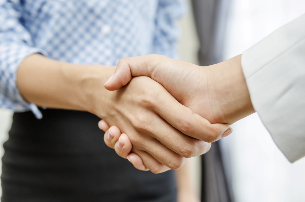 two people shaking hands