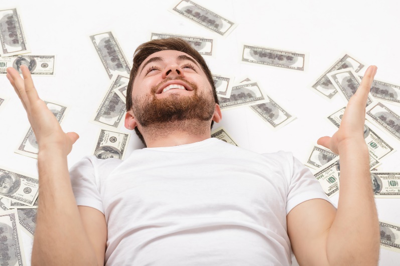 happy man surrounded by money