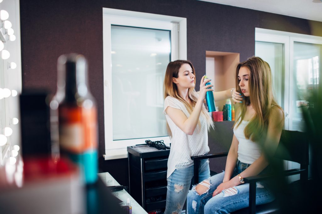 woman getting her hair done in a salon