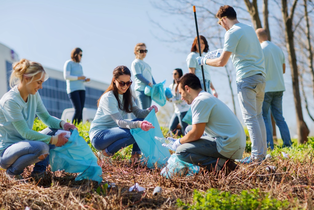 group of volunteers cleaning the community